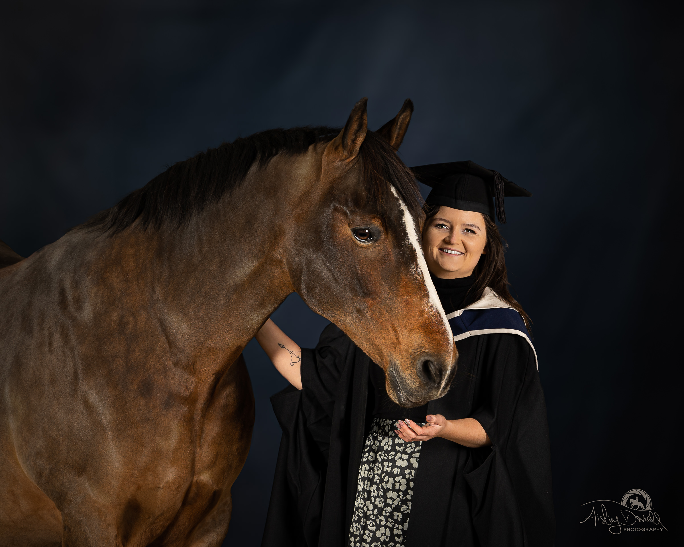 Graduation photo portrait with horse