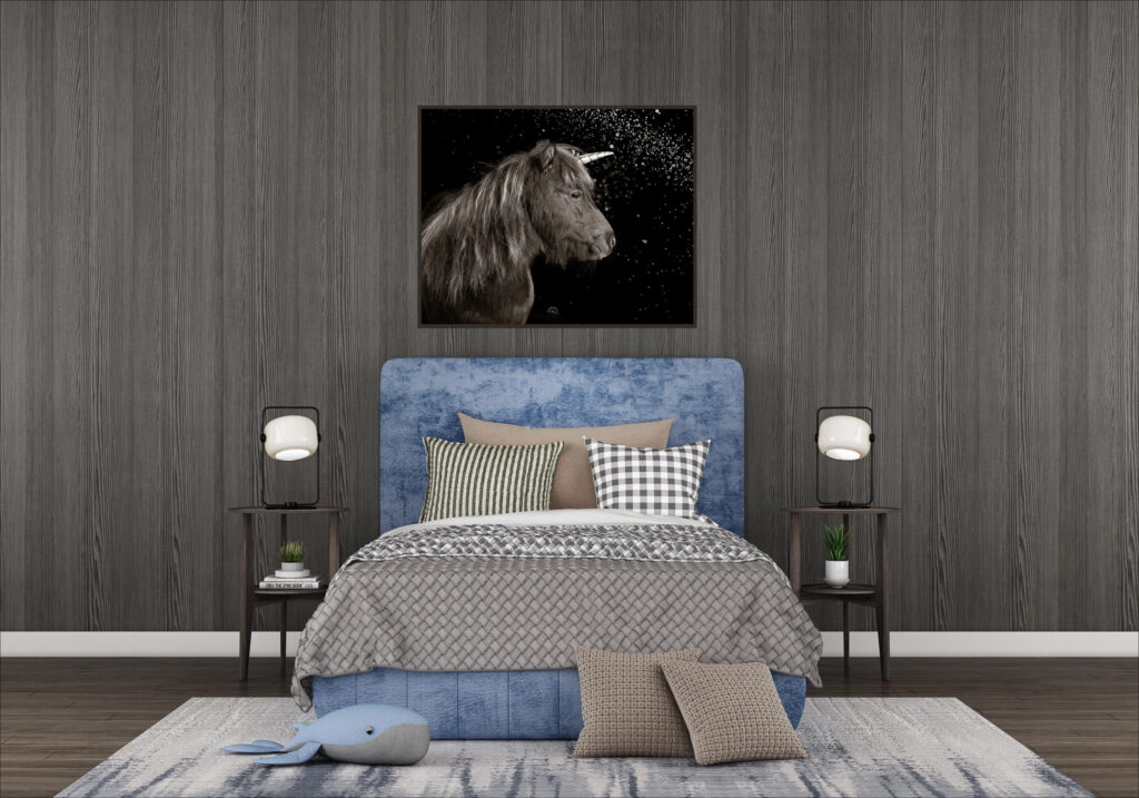 A bedroom with a fine art picture of a miniature horse on the wall