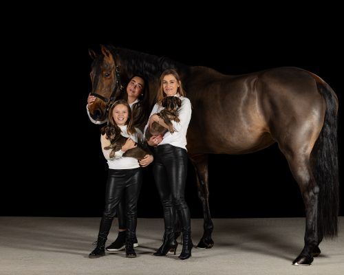family portrait photo with horse and dogs